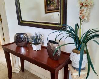 Entry table, concrete pillars