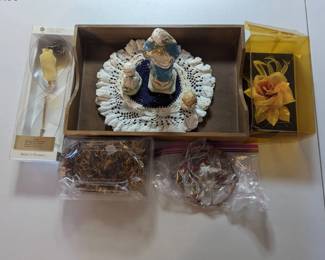 PPE026-Assorted Figurines, lei, flowers and a wind chime