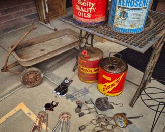 Outdoor rustic!! Cast iron stand w/ iron grate table, kitty wind chimes, oil and gas cans  and Greyhound wagon (as is)