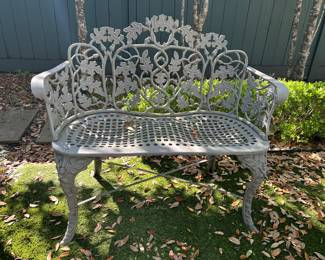 Old ornate garden set: dining table with 4 chairs and a settee