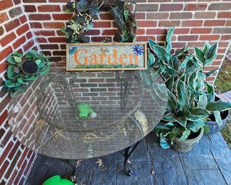 Table and artificial greenery