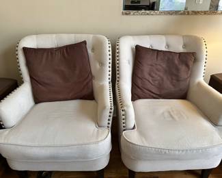 A pair of matching living room chairs