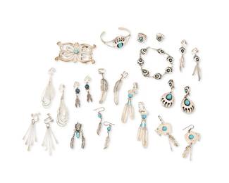 349
An assortment of Southwest-style silver and turquoise jewelry
Late 20th century
Variously marked for sterling and for maker: F / P / CK [?] / RB
Comprising a cast silver belt buckle with set turquoise, a mixed set of sterling silver bear paw motif jewelry with set turquoise including a cuff, a link bracelet, two pairs of earrings, and two rings, as well as five pairs of earrings and a pendant with feather and/or bison motifs with set stones, plus a pair of liquid silver strand earrings, and a pair with long flat dangles, 24 pieces
Buckle: 1.75" H x 3" W; bracelets: 6.25 " inner C & 7.75" L; earrings: 3.25" H to 2.125" H; ring sizes: 7 & 5.5
135.0 grams gross
Estimate: $100 - $200