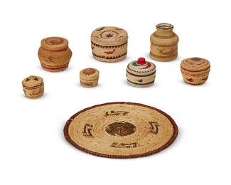 237
A group of Northwest Coast baskets
Early/mid-20th century
The twined baskets, each variously decorated, most depicting nautical motifs, comprising six diminutive lidded baskets, one basketry tray, and one basketry-encased glass bottle
8 pieces
Tray: 7.75" Dia.; Largest lidded: 2" H x 3" Dia.; Smallest: 1.25" H x 1.5" Dia.
Estimate: $200 - $300