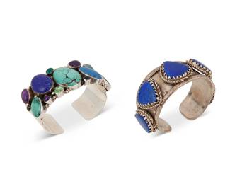 248
Two Southwest-style silver and set stone cuff bracelets
Late 20th century
Lapis cuff marked to terminal: 925
Comprising a sterling silver tapered cuff with five bezel-set heart-shaped lapis lazuli stones, and with raised stamped edges, and a chunky silver cuff with multiple set stones and gemstones, including lapis, turquoise, and amber, 2 pieces
Larger: 7" total inner C x 1.25" H, with a 1" gap; smaller: 6.75" total inner C x 1.375" H, with a 1" gap
196.9 grams gross
Estimate: $300 - $500