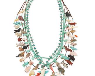 309
A group of Southwest carved stone fetish and turquoise necklaces
Mid/late 20th century
Comprising a turquoise nugget and heishi necklace with carved antler standing bear pendant, a carved turquoise fetish necklace with heishi spacers and various animals, two carved multistone fetish animal necklaces, one with a central turquoise thunderbird, and one with a central carved jet bear, as well as two strand necklaces of graduated turquoise heishi, each with a silver bead and hook clasp, 6 pieces
Largest: 33" L; smallest: 25.5" L
163.5 grams gross
Estimate: $300 - $500