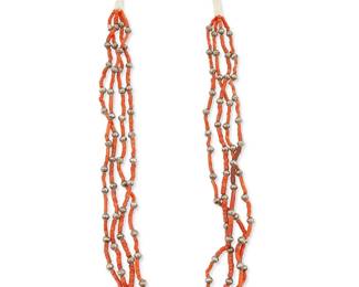 271
A Southwest Pueblo coral and silver necklace
Mid/late 20th century
A four-strand necklace with coral beads and diminutive silver bead spacers, with a traditional wrapped neck cord and turquoise bead to cord
28" L
58.1 grams gross
Estimate: $400 - $600