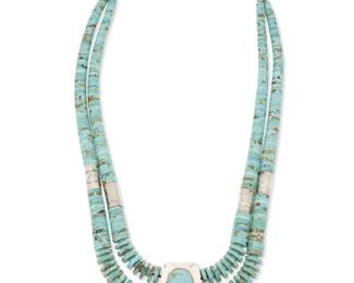 261
A Jimmy Calabaza "CA 'WIN" Santo Domingo Pueblo turquoise and sterling silver necklace
Jimmy Calabaza (b. 1949, Kewa)
Late 20th century
Stamped: "CA 'WIN"
A chunky double stand turquoise necklace with graduated disc beads, silver stampwork spacers, and a central silver trapezoid pendant with large set turquoise cabochon
26.5" to 30" L x 1.875" H
271.3 grams gross
Estimate: $1,000 - $2,000
