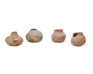 259
Four Native American pottery cooking jars
Pre-historic or later
Comprising one possibly Mimbres jar with incised details to shoulder, one Oola bottle, another pot, and a jar with opposed holes for a handle below a flared rim
4 pieces
Largest: 4.5" H x 5.5" Dia. approximately; Smallest: 4.125" H x 4.875" Dia. approximately
Estimate: $100 - $150
