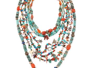 308
A group of Southwest turquoise and stone necklaces
Mid/late 20th century
Comprising five necklaces in various sizes with multistone beads including turquoise, lapis lazuli, coral, heishi shell, and silver beads, including a double strand necklace with multiple silver Southwest motif charms, and two necklaces with carved stone fetish animal accent beads, 5 pieces
Largest: 33" L; smallest: 18" L
367.6 grams gross
Estimate: $200 - $400