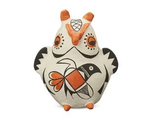 257
An Acoma Pueblo pottery owl figure
Marked to underside: Acoma NM
The three-color owl figure with parrot motif to abdomen and painted details in orange and black on white slip
6.875" H x 5.875" W x 5" D
Estimate: $100 - $200