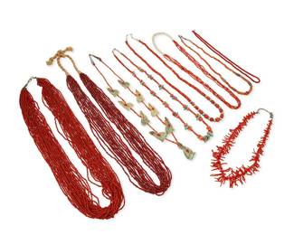 314
A group of Southwest coral, red glass, and carved stone necklaces
20th century
Wolf pendant signed to base: H Watson / Navajo
Nine works comprising an H Watson Navajo (b.20th century, Diné) carved green stone heartline wolf fetish necklace with coral heishi spacers, as well as a twelve-strand red and white "white hearts" glass bead necklace with twisted thread neck cord, together with a single strand necklace of red branch coral, two multistrand fine coral heishi bead necklaces, and four further single strand necklaces with various sized coral beads, one with silver beads and one with turquoise nugget accents, 9 pieces
Largest: 33" L; smallest: 19" L
608.7 grams gross
Estimate: $500 - $700