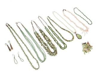 300
A group of Southwest turquoise and shell jewelry
Mid/late 20th century
Pendant stamped: B / Sterling
Eleven works comprising a single strand pale green stone necklace with alternating barrel and disc beads with a stone set sterling silver pendant, a graduated strand of pale pink and white branch coral, and a turquoise heishi multistrand necklace with a pair of matching earrings, together with five further turquoise and green stone nugget and bead necklaces of various sizes and styles, and a pair of multistone graduated disc earrings, as well as a collection of approximately 64 loose carved stone fetish animal beads, 76 pieces approximately
Largest: 32" L; smallest: 15" L; earrings: 2.5" H
398.5 grams gross
Estimate: $500 - $700