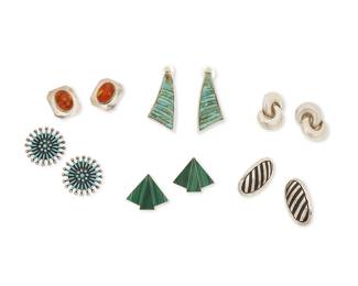 327
A group of Southwest-style silver and stone set earrings
Late 20th century
Six works:

Sibert Bowannie (b. 20th century, Zuni Pueblo)
A pair of Zuni sterling silver and needlepoint cluster-set turquoise earrings
Etched verso: Sibert Bowannie / Zuni
Each: 1.25" Dia.

Jennifer Juan Runnels (b. 20th century, Diné)
A pair of Navajo sterling silver oval earrings with striped silver overlay
Stamped: G & J Runnels / Sterling
Each: 1.5" H

A group of Southwest-style sterling silver earrings
Each variously marked for sterling
Comprising four pairs of earrings, three with various set stones including malachite, turquoise, and amber, 8 pieces
Largest: 2.25" H; smallest: 1" H

12 pieces total
67.0 grams gross
Estimate: $100 - $200