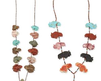 266
Two Zuni Pueblo carved stone fetish necklaces
Late 20th century
Comprising a Louise Singer (b. 20th century, Zuni) frog fetish necklace, with twelve chunky carved stone frogs in various stones including turquoise, and a large central carved greenstone frog, on a fine shell heishi strand with a silver cone clasp (28" L), and a carved stone bison buffalo fetish necklace in various stones including turquoise, pipestone, spiny oyster, jet, abalone, and greenstone, with fine heishi spacers and a silver cone clasp (29" L x 2" H), 2 pieces
230.9 grams gross
Estimate: $400 - $600