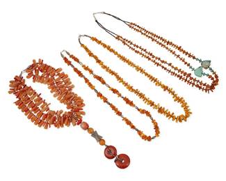 312
A group of Southwest-style amber and stone bead necklaces
Late 20th century
Comprising an elaborate three-strand collar necklace with coral, aventurine, and silver beads, suspending a long coral, agate, and silver pendant, as well as three necklaces each with various sized amber nugget beads, with either silver beads or heishi shell spacers, including a double-strand amber necklace with carved turquoise bear fetish figures and turquoise bead accents, 4 pieces
Largest: 34" L; smallest: 20" L x 8" H
495.0 grams gross
Estimate: $400 - $600