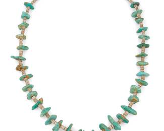 291
A Southwest turquoise nugget necklace
Mid/late 20th century
Unmarked
A Southwest Pueblo-style chunky single strand with graduated turquoise nuggets and variegated shell spacers
32.5" L
144.5 grams gross
Estimate: $200 - $400
