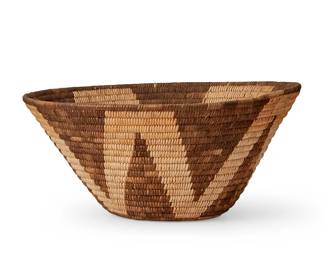 225
A Pima basketry bowl
Early/mid-20th century, Akimel O'odham; Southwest United States
The coiled basket with a brown central star motif
5.75" H x 11.875" Dia.
Estimate: $200 - $300