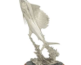 91
Kent Ullberg
b. 1945
"Flying Sail"
Stainless steel on stone base and wood plinth
Edition: 2/20
Signed and numbered in the casting: © Ullberg / 8; attributed and titled to metal plaque applied to plinth
Bronze: 20" H x 11" W x 5.5" D; Overall: 25" H x 12.75" W x 8.25" D
Estimate: $1,000 - $2,000