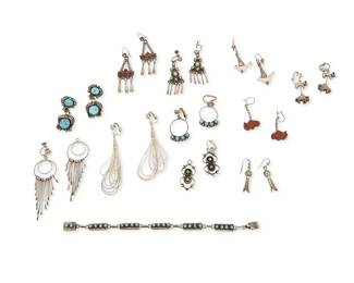 347
A group of Southwest-style silver and set stone jewelry
Late 20th century
One marked for sterling
Comprising eleven pairs of silver earrings in various styles and with various stones including stranded liquid silver beads, set turquoise, row-set coral and turquoise, squash blossom, and carved stone and silver animal fetish figures, as well as a silver link bracelet with row-set turquoise, 23 pieces
Largest earring: 3.25" H; smallest: 1.5" H; bracelet: 7.5" L x 0.25" H
95.8 grams gross
Estimate: $200 - $400