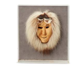 229
Lela Ahgook
b. 20th century, Nunamiut/Anaktuvik Pass
Inuit mask
Caribou hide, hooves, and fur
Appears unmarked, with associated bearing attribution taped to case verso: Authentic Handicraft from Alaska
Mask overall: 13.5" H x 11.5" W x 3" D approximately
Estimate: $100 - $150