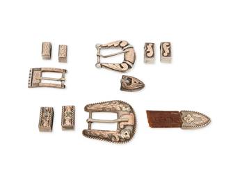 319
Three Western-style sterling silver ranger belt buckle sets
Mid/late 20th century
Variously marked for Mexico, sterling, and maker
Three works comprising a "Real" Mexican chased sterling silver and mixed metal overlay ranger set with a buckle (1.875" H x 2" W), two keepers (0.875" H), and an end tip (0.75" H), as well as a mixed metal overlay buckle (1.5" H x 1.25" W), with two keepers and an end tip (each: 0.75" H), and an "A. Fonseca" small Mexican sterling silver buckle with chased overlay (0.875" H x 1.5" W) and two keepers (0.625" H), 11 pieces
119.2 grams gross
Estimate: $200 - $400