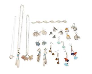 342
A group of Southwest jewelry
Late 20th century
Variously marked for sterling and for maker: GS /RG
Fifteen works comprising primarily bear-themed jewelry including a heartline bear and feather pendant necklace with set turquoise and a pair of matching earrings, a small silver bear motif pendant on a fine chain, with a similar style sterling silver link bracelet, as well as a necklace with a carved stone bear pendant and a horse pendant, plus four pairs of carved stone animal earrings, in lapis lazuli, coral, turquoise, and tigers eye, and five further pairs of silver and set stone earrings, four in bear motifs and one a diminutive thunderbird pair, 24 pieces
Necklaces: 21" L to 18" L; earrings: 3.25" H to 0.5" H; bracelet: 8" L x 0.625" H
138.5 grams gross
Estimate: $100 - $200