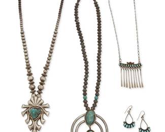 338
A group of Southwest silver and turquoise jewelry
Mid/late 20th century
Naja stamped verso: MC; petit point etched verso: Marci T / Zuni
Four works comprising a two-wire naja pendant necklace with two set turquoise stones, suspended from a single strand of silver beads with turquoise bead accents, as well as an ornate chunky cast silver pendant with central set turquoise suspended from a single strand of graduated silver beads, a Zuni Pueblo silver and row-set petit point turquoise and coral pendant necklace with silver dangles, and a pair of row-set turquoise earrings, 5 pieces
Largest: 25.5" L x 3" H; smallest: 19.5" L x 2.25" H; earrings: 1.75" H
161.5 grams gross
Estimate: $400 - $600