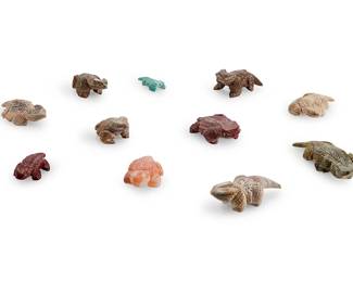 324
A group of Zuni carved stone horned lizard fetish figures
Mid/late 20th century
Seven attributed to and marked in various hands: Louise Singer
Comprising eleven horned lizard figures, most with turquoise or coral inlaid eyes
11 pieces
Largest: 1" H x 3" W x 1.875" D; Smallest: 0.625" H x 1.875" W x 0.875" D
Estimate: $200 - $400