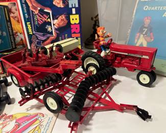 1970's International Die Cast Red Tractor Disc Plow Spreader Toy