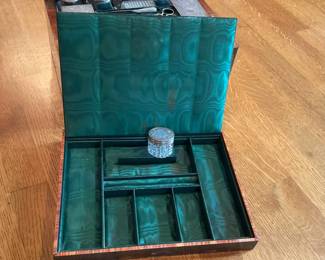 Burlwood box with travel toiletry items fitted interior.