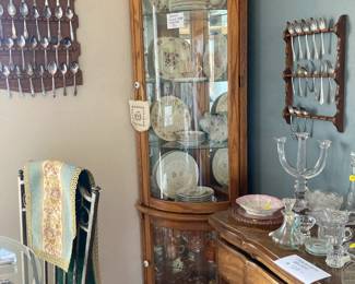 Corner cabinet with vintage dishes, spoon rack