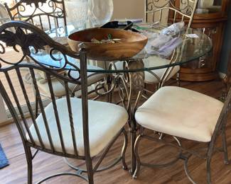 Round glass top dining table with iron base and iron chairs (4)