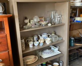 Storage shelves, dishes, cookbooks, DVD's