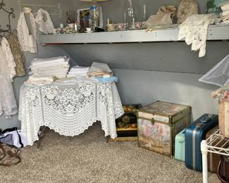 Lots of tablecloths, small treasure boxes, napkins, accessories