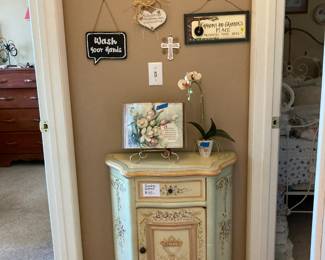 Small painted cabinet, plaques on wall