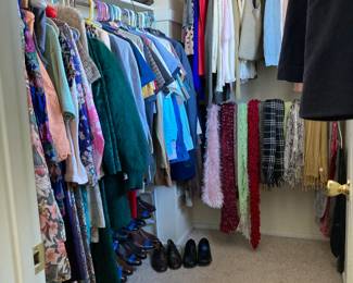 Closet full of men's and women's clothes - brand labels and some vintage, men's shoes and boots, scarves
