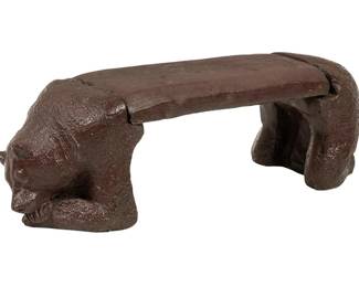 Concrete garden bench with sleeping bear design