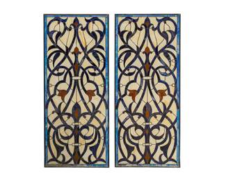 Slag glass windows with polychrome pieces, and scroll motifs