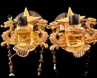 This is something we’ve never seen before! A pair of earrings crafted from vintage Jacomo sample sized perfume bottles. We believe these were display pieces in a department store after doing the research. They’re really special and unique!