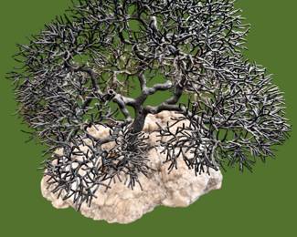 Bill Webb bronze tree sculpture mounted on granite. There are birds and bird’s nests hidden in the tree. It’s great!