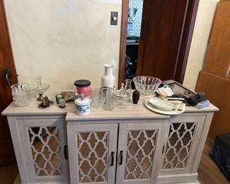 Mirrored credenza. Lots of odds and ends and serving options!