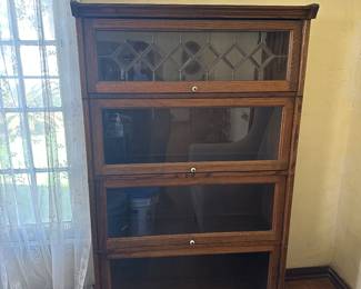 Beautiful bookcase - see next photo for how it opens. Just offscreen is a comfy armchair!
