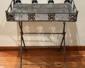 Decorative Metal Side Table
Pre-owned. Table Measures 23in H | 19.75in L | 13in W. ( The table top frame is missing some round glass accents from the flower centers).