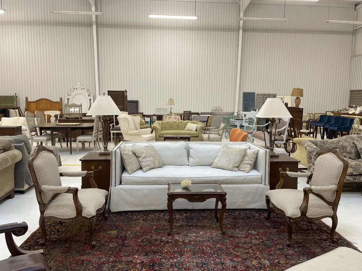Wesley Hall tuxedo style nail head linen sofa , pair of French arm chairs, French glass and wood coffee table, Oriental rub
