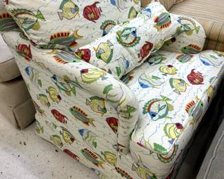 upholstered club chair with fish motif