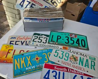 Lots of license plates with multiple states and years. 