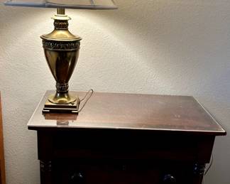 Two mahogany night stands.   Each measures 32” long x 17” wide x 28.75” tall, 3 drawers with ample storage in each drawer.  Brass lamp.  