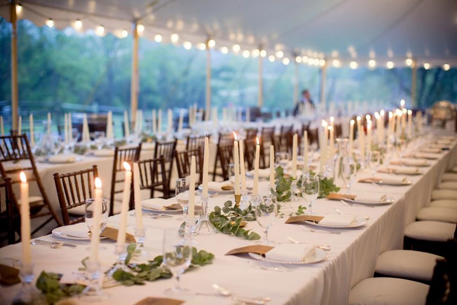 View of the dinner ware at our wedding - plates, candlestick holders, silverware 