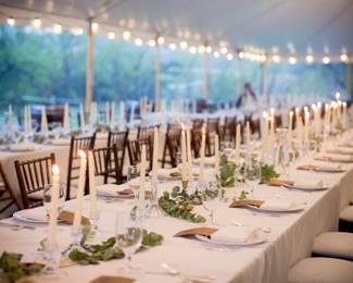 View of the dinner ware at our wedding - plates, candlestick holders, silverware